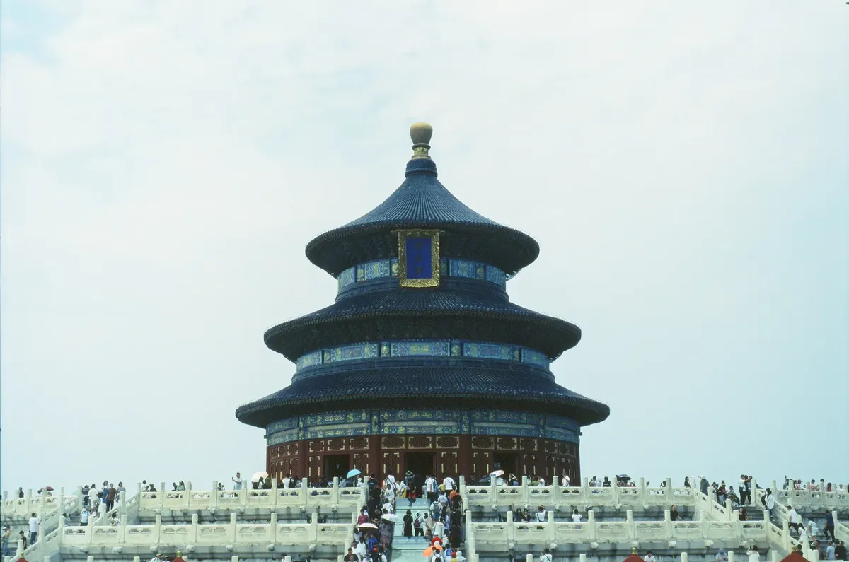 The iconic Temple of Heaven in Beijing, a renowned UNESCO World Heritage site, with visiting tourists.