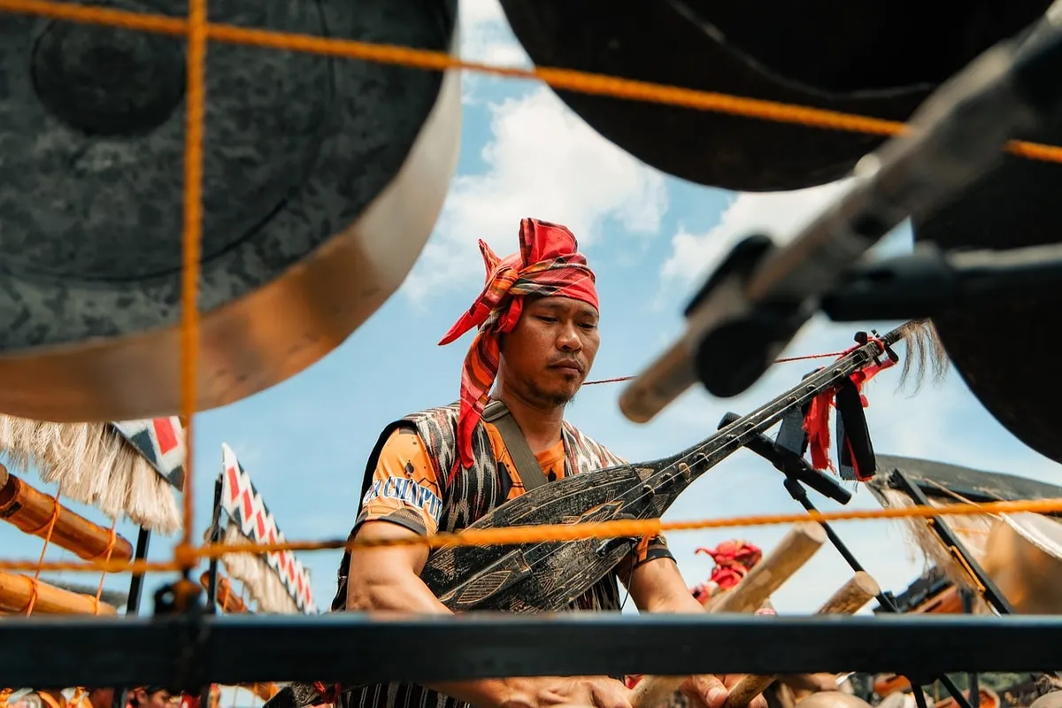 musician, traditional clothing, cultural festival, traditional music, festival, traditional, musical instrument, drum, man, ethnic, outdoor, sky, blue, blue sky